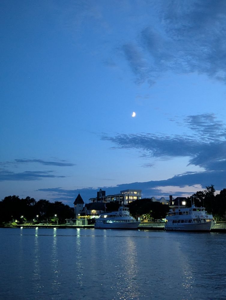 A view of the Gananoque shoreline from the cruise boat at sunset 