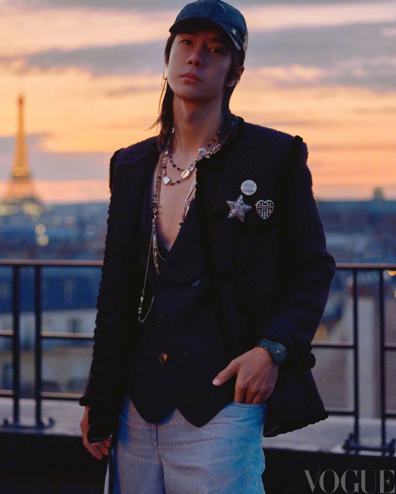 Wang Yibo in Chanel on a Parisian rooftop - showing a bit of chest 
