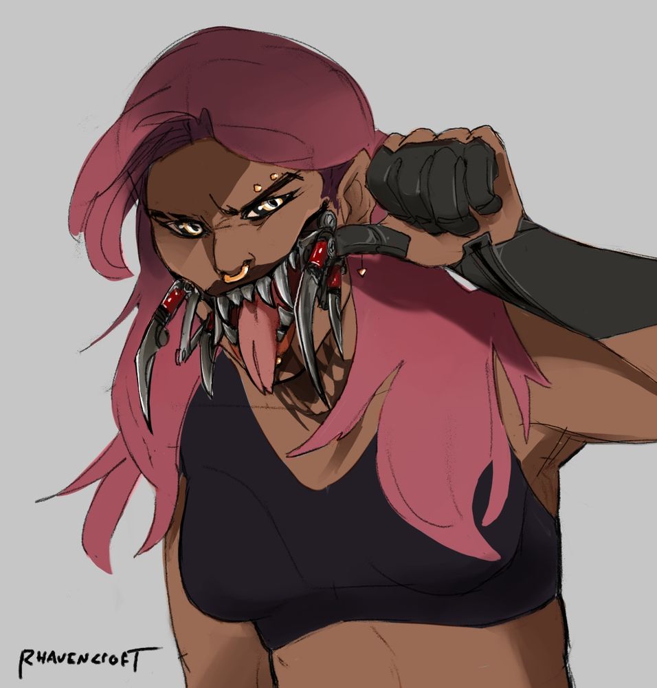 A pink haired vampire with brown skin shows off metal teeth and the other horrible metal sharp things in her mouth