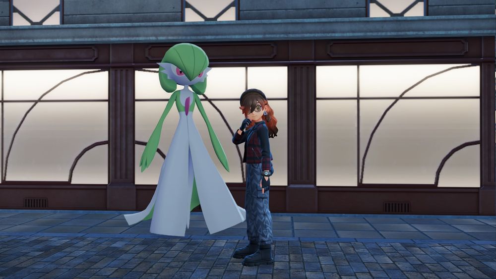 a photo of my trainer, making a thinking face looking into the camera, while my alpha gardevoir stands to the left,