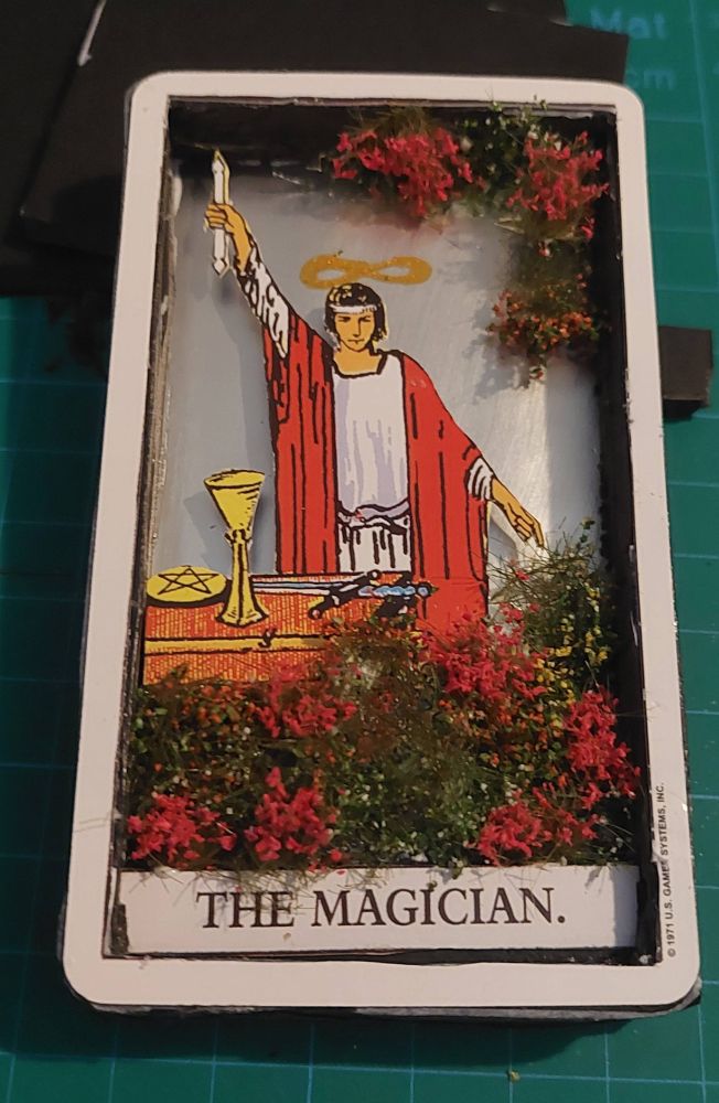 photo of the Magician card - this has also been cut up to create a 3d image... there are flowers and vines added to the piece
