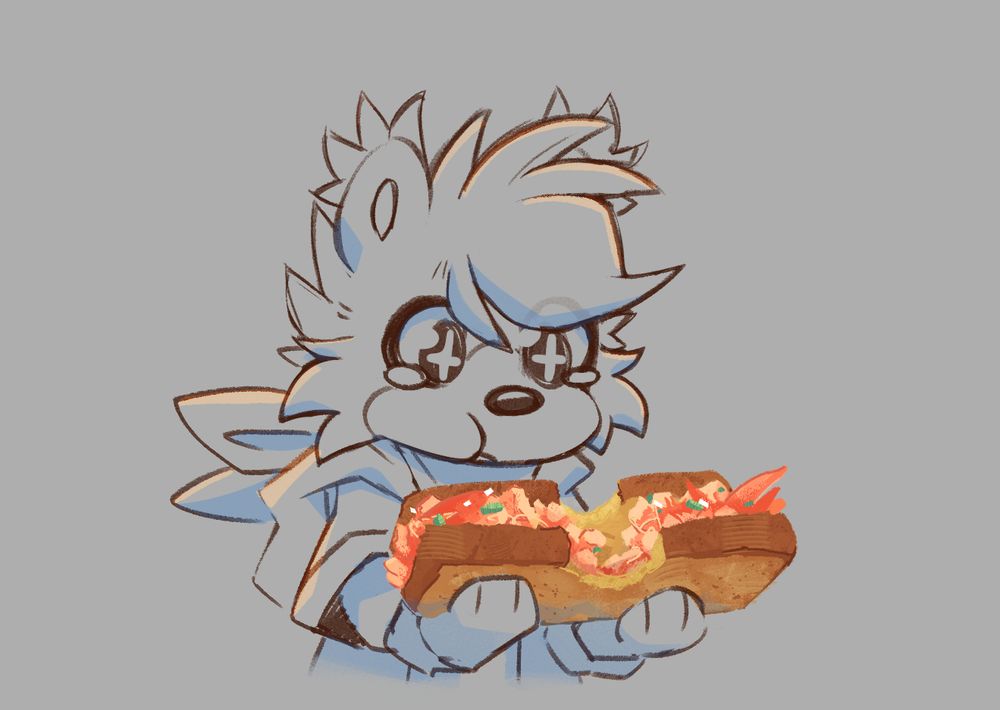 Feza, with stars in her eyes, holding lobster between a toasted piece of bread, in her hands.