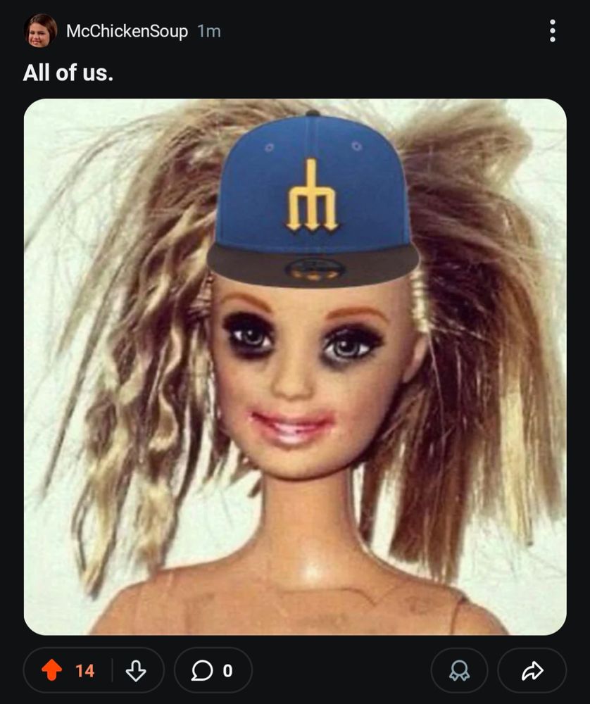 A Barbie doll looking like she's fresh off a 3-day bender, hair deranged, make-up smeared, no sign of clothing except for the Mariners baseball cap photoshopped onto her head.