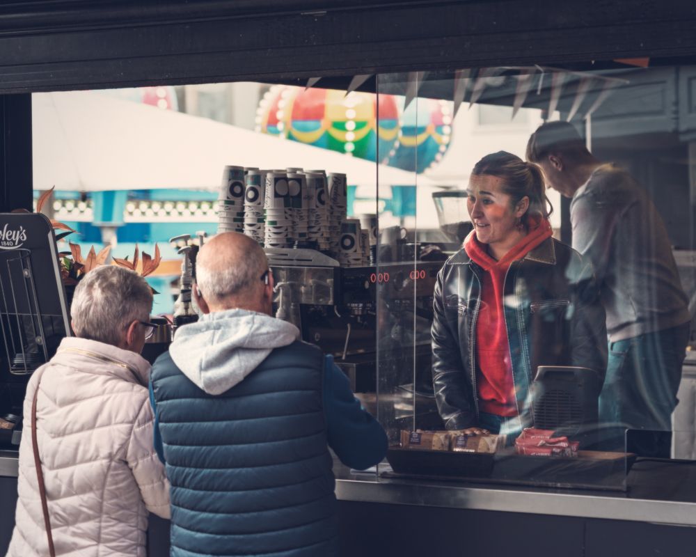 Couple getting coffee and a bit of chat. 