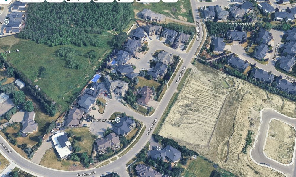 Massive suburban homes across the street from the proposed development within walking distance from an LRT station