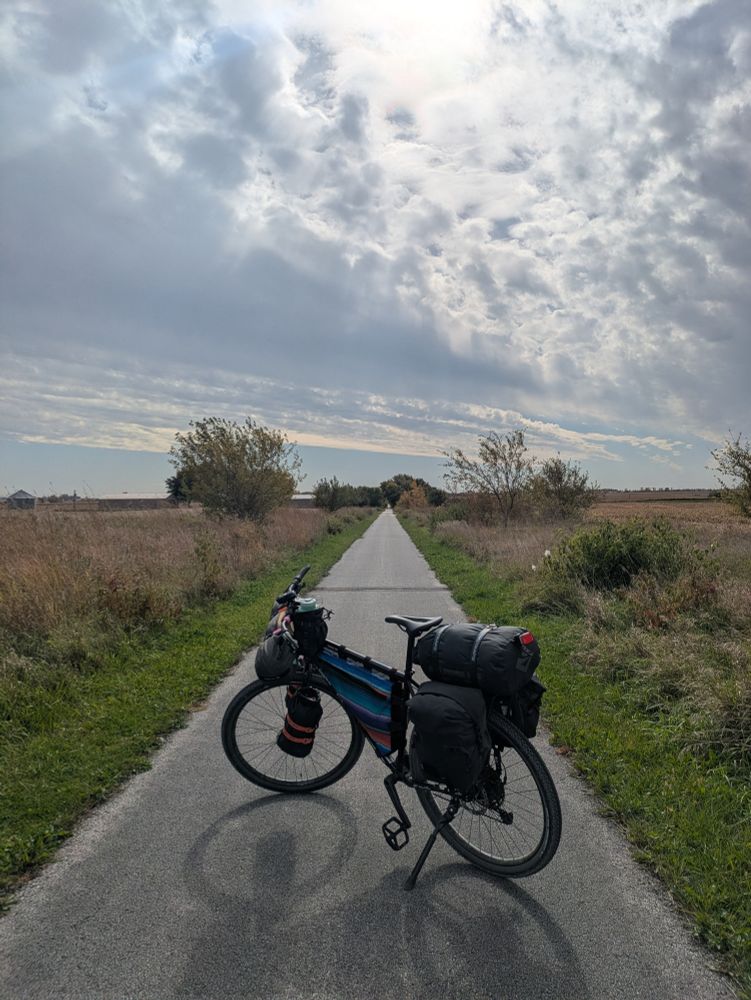bike on a straight paved bike path in rural farm land