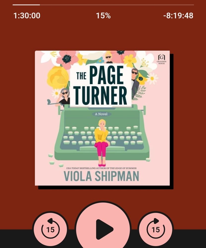 Screenshot of the Libby app showing Andrea's current listen: The Page Turner by Viola Shipman. The cover art shows a young blonde woman in a yellow top, bright pink Capri pants and pink shoes sitting on the spacebar of a giant green typewriter. The title is displayed on a piece of paper in the typewriter, and flowers bloom behind the paper. 3 other small figures peek around the paper.