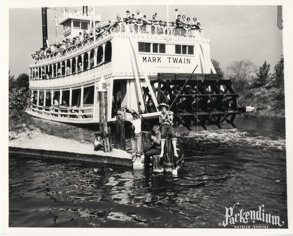 1955 publicity photograph with caption: OPEN SEASON -- Parked on a wharf beside the paddle-wheeler which recalls the famous adventures of Huckleberry Finn's days, three county youngsters catch the first fish of the "season" from the Disneyland version of the Mississippi. Left to right are Tom Nabbe, 837 Cottonwood Center, Anaheim; Gary Chase, 711 Rose Dr., Anaheim; and Hugh Allen, 1025 Culbridge St. (Register Photo)