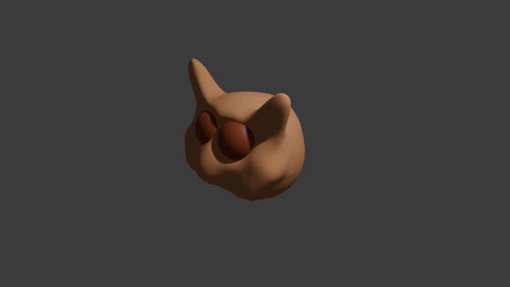 A horrible sort of owl, bear thing sculpted rapidly by someone who is not an artist