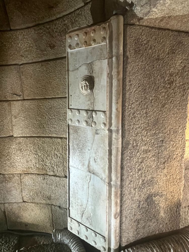 One of the doors of the tomb-chamber. Marble, carved to resemble wood with metal reinforcing bosses. There is also a small Gorgon head on the upper half of the door