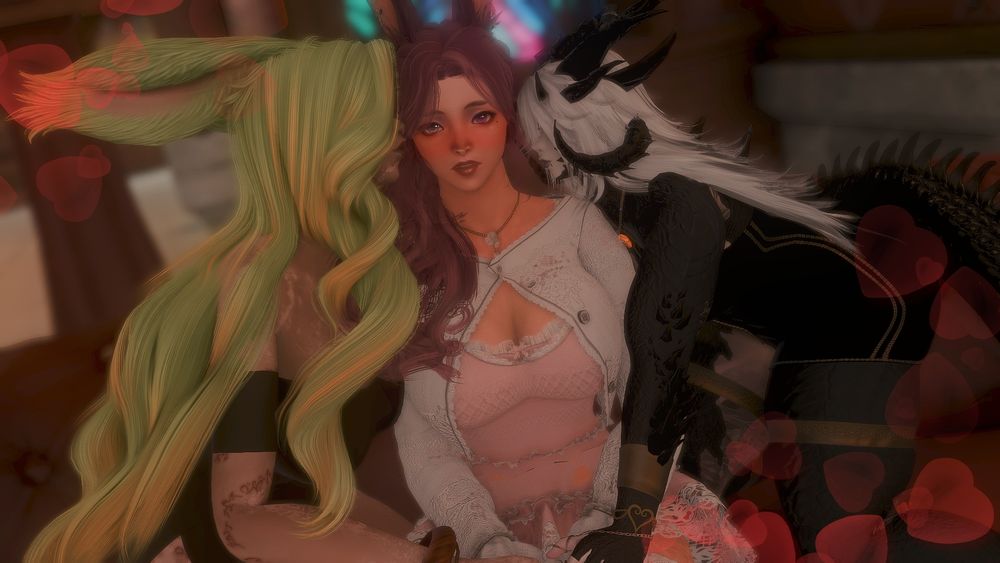 Asel (left), Theja )middle), and Mordra (right) are sitting on a plush couch. Theja, a viera with pink hair, sits in the middle in a pink dress with a white cardigan overtop and a floral necklace. Her expression is surprised with a bright blush across her cheeks. To her right is Asel, a green haired rava/veena viera with vitiligo, who is puckering up her lips and leaning in to kiss Theja's cheek. She wears a black off the shoulder bodysuit. To Theja's left is Mordra, a xaela au ra with extra black scales, spikes, and multiple horns on her head. She has white hair and dark makeup on. She wears a black dress and is on her knees on the couch to also pucker up her lips to also lean in to kiss Theja's cheek. There are hearts around them.