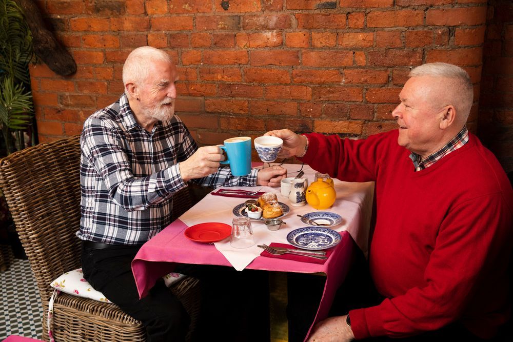 Older people having tea
