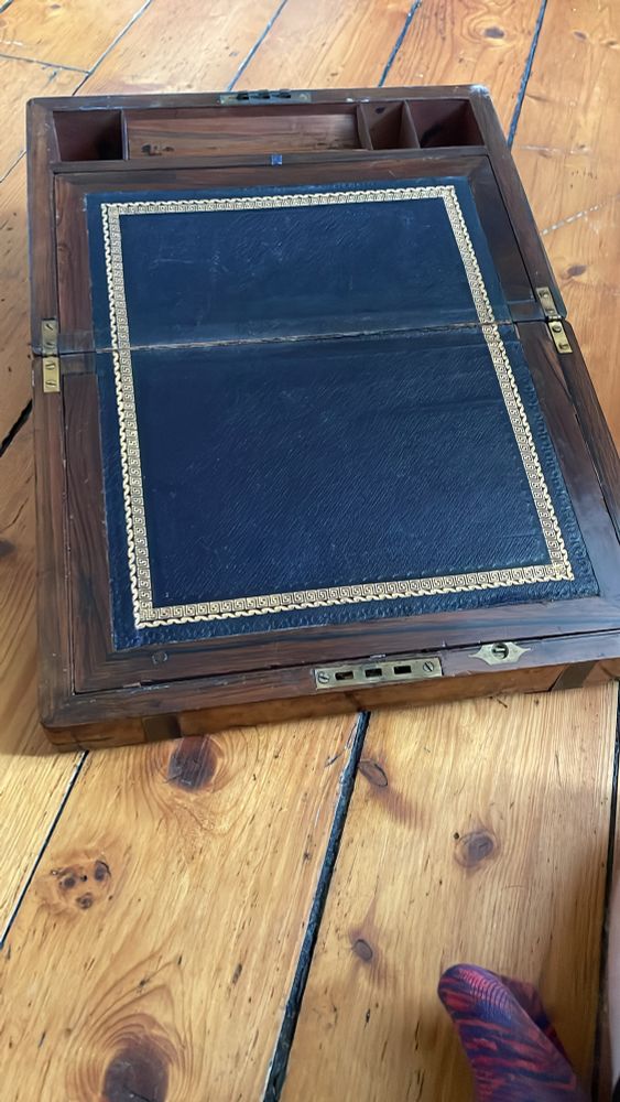 The same style fold out wooden writing block with black leather writing pad and brass fittings 