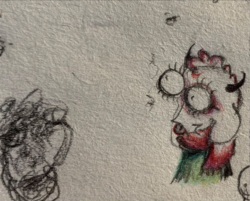 A sketch of Ralsei at the right poking his tongue out.