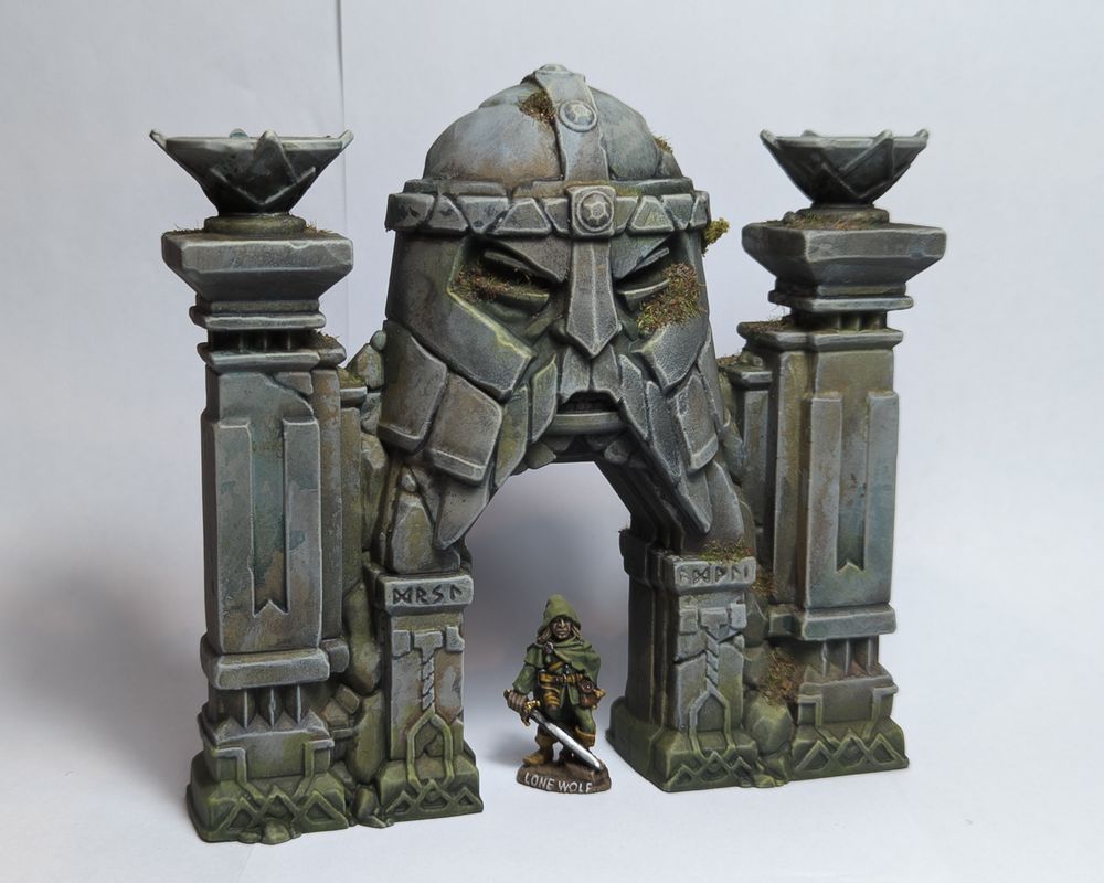 Front view of Dwarven mine entrance, made to look old and ruined, with Lone Wolf striding through...