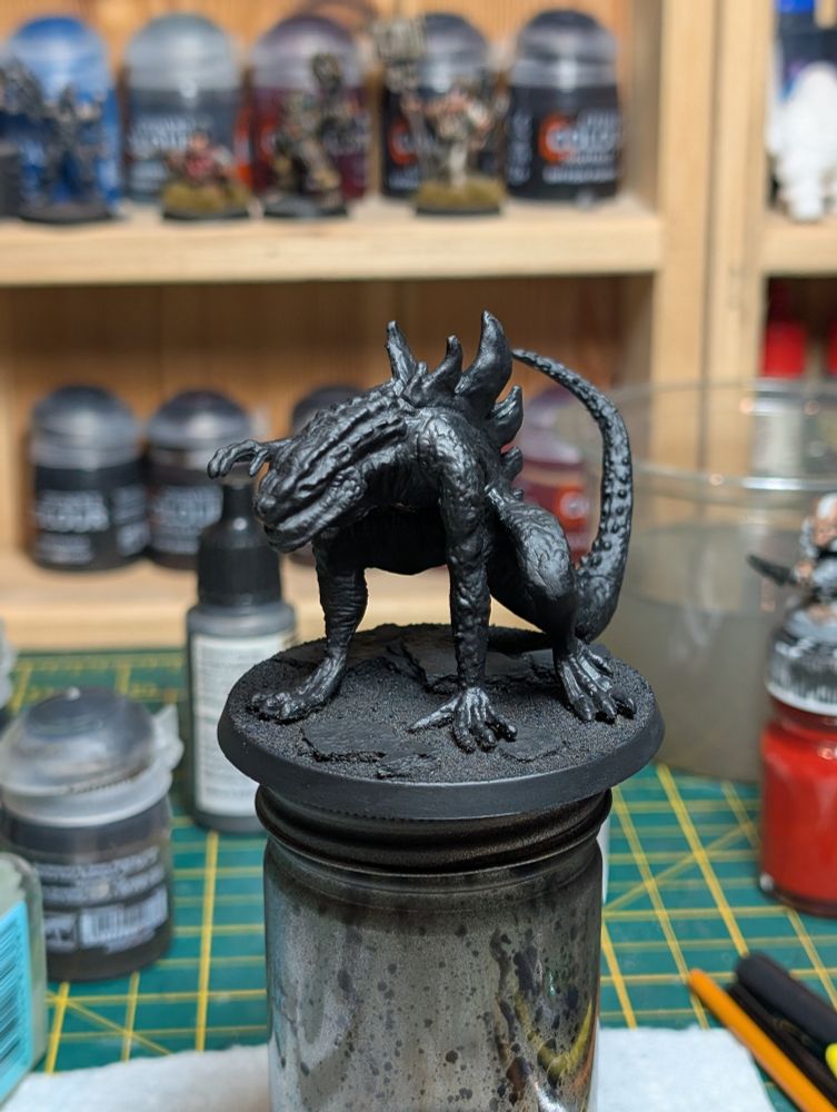 Weird Alien/dinosaur kids toy, now based on a 60mm base and primed black.