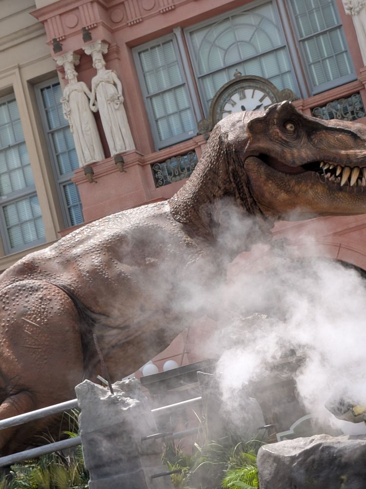 Jurassic Park float, with mist and dino.