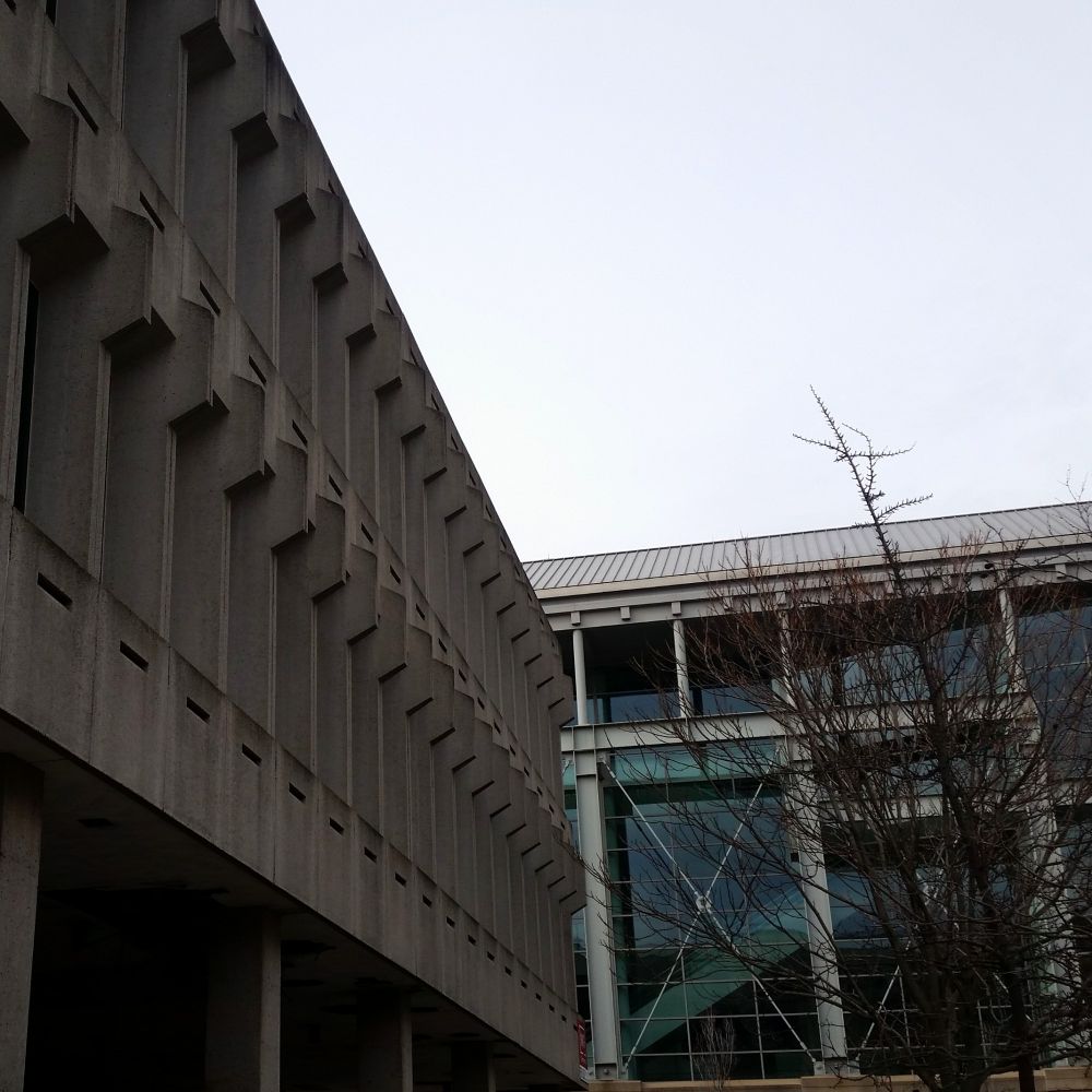 A since demolished brutalist building (I don't remember the name) intersecting perpendicular to the large glass windows of the Providence Journal building 