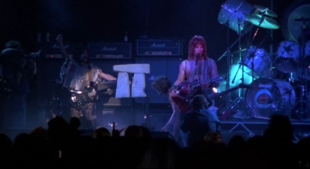 Spinal Tap perform the song “Stonehenge” while a rather underwhelming prop takes center stage