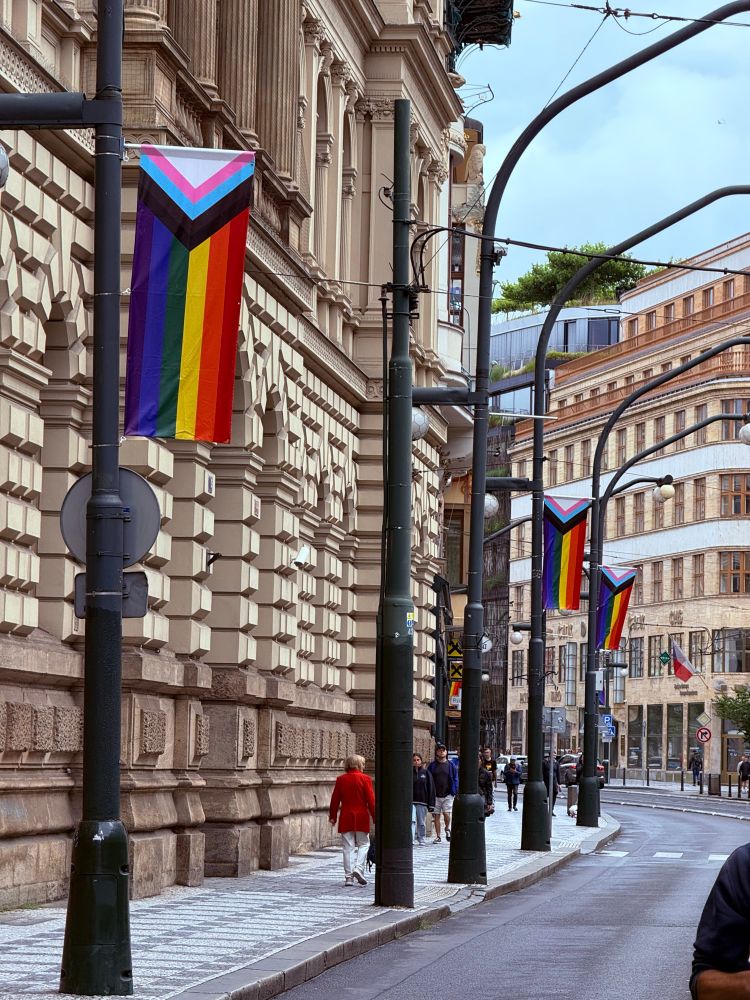 Pride flags on lampposts lining the street