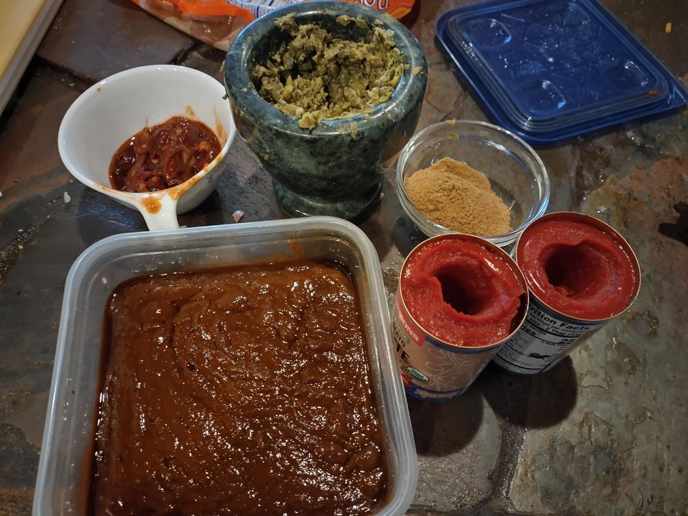 Cumin, tomato paste, homemade chili paste, chopped chipotles in adobo, and pastified capers 