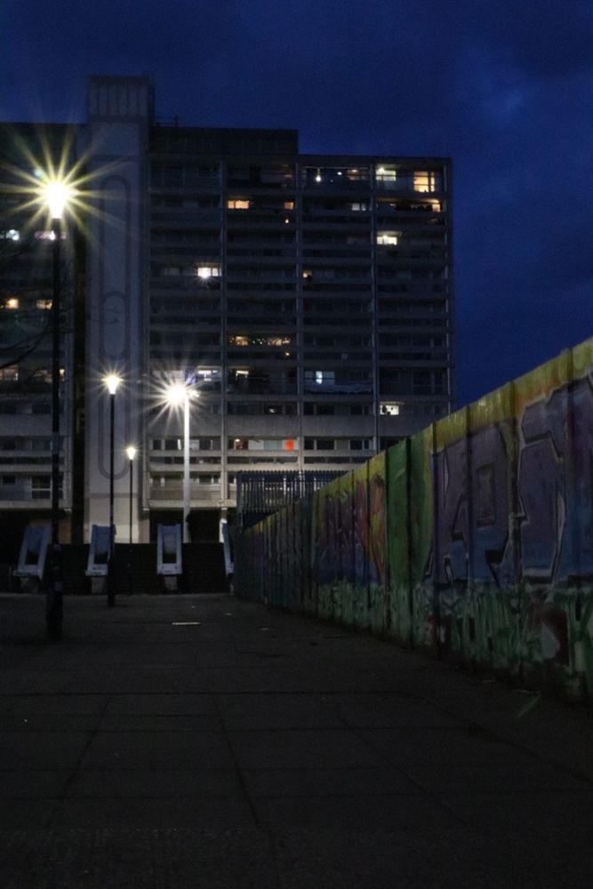 High Rise flats and fence covered in graffiti