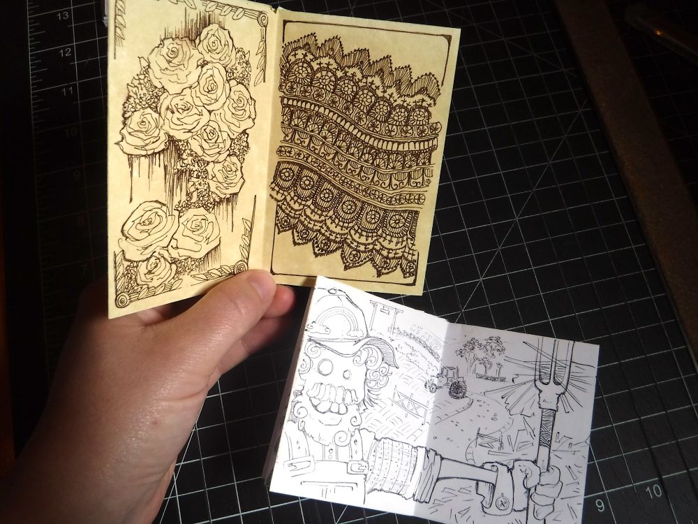 A pair of doodles, showing floral patterns, lace, and a silly farmer. Making art is haaaard, okay? Sometimes I just want to doodle without trying to "make" something "good." Did I kill two pens while doodling these? Absolutely. Was it worth it? Also yes. 