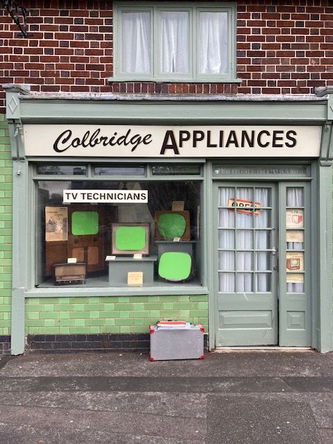 Moira's Wet Fish shop as 'Colbridge Appliances' in 2023 (complete with green screens on the TV sets in the window ready for 1950s programmes to be added digitally).