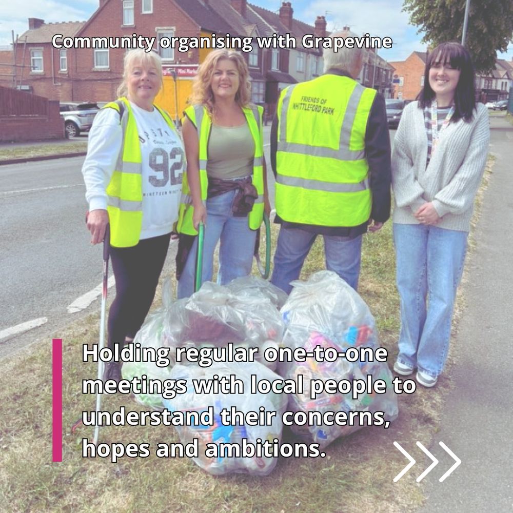 Three women and one man, all white, stand holding litter pickers behind clear plastic bags filled with rubbish they have collected from the local area.