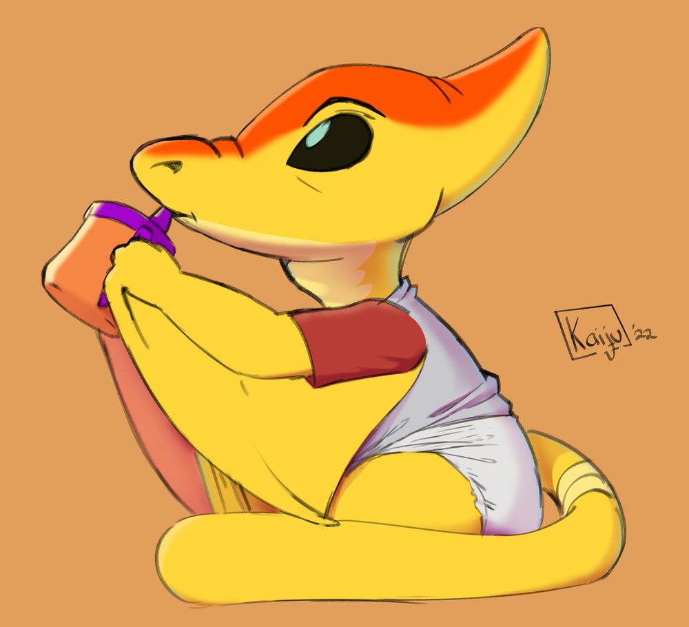 Slugger sitting in a diaper and shirt. He's drinking from a sippy cup