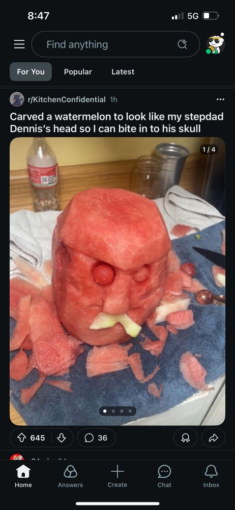 Reddit post: Carved a watermelon to look like my stepdad Dennis’s head so I can bite in to his skull. A watermelon is carved to look like the head of a man. 