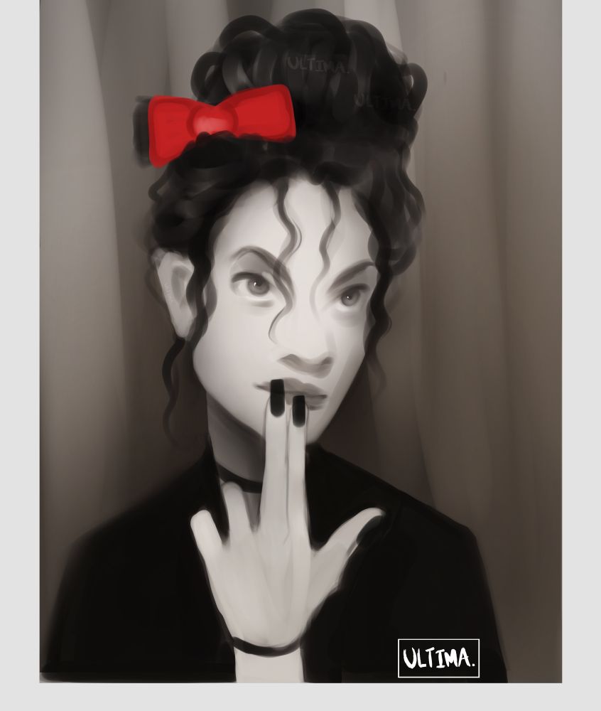 A woman with a curly bun sitting in a Photo Booth 