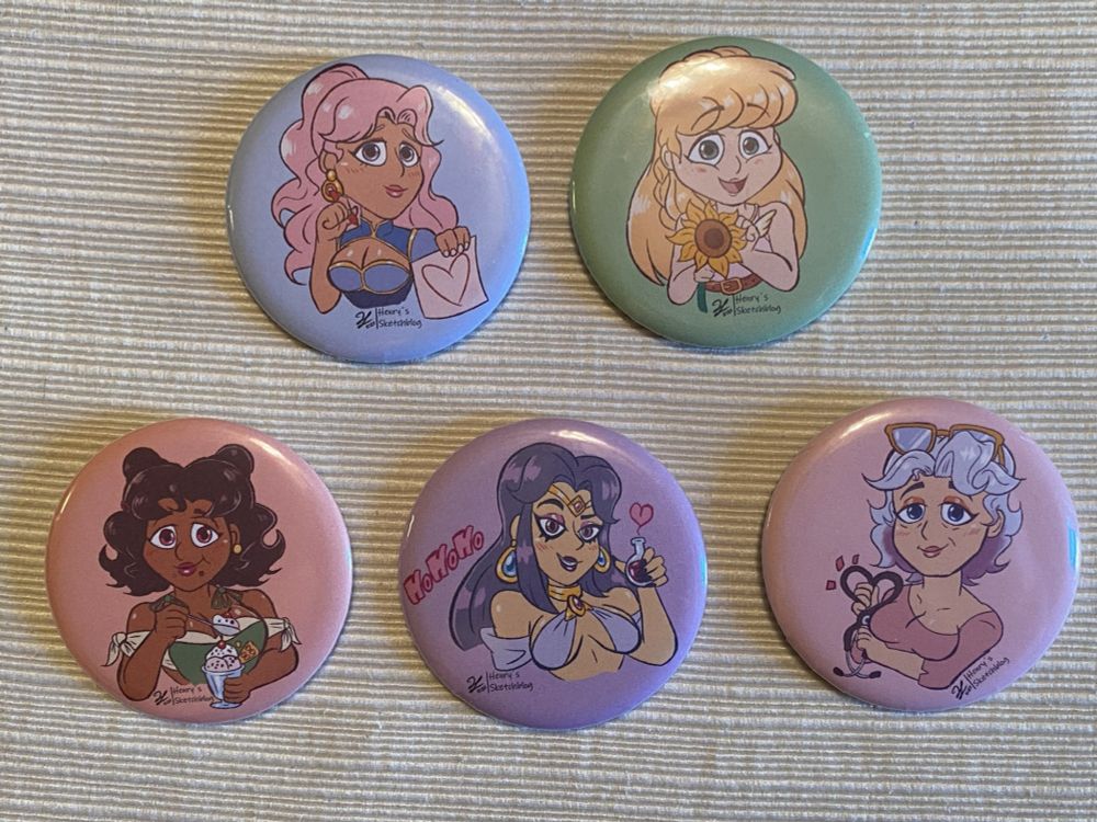 Badges/buttons of the bachelorettes from Fields of Mistria! Valen, Juniper, Adeline, Reina and Celine.