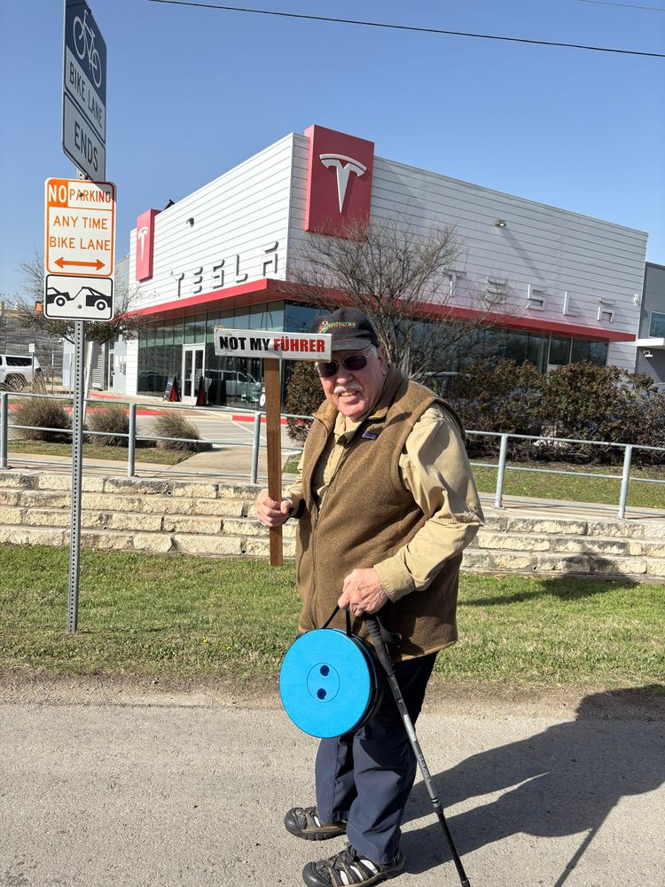 Protestor holding sign that says “Not my Fuhrer” 