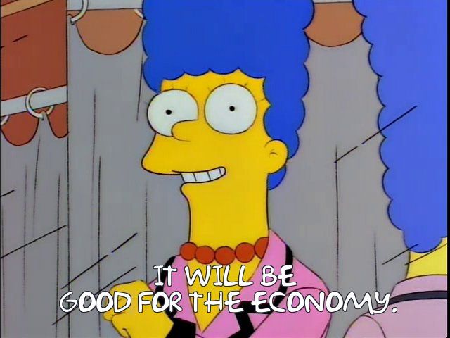 A screenshot from the Simpsons, Marge is standing in a new suit and smiling while saying "It will be good for the economy". 