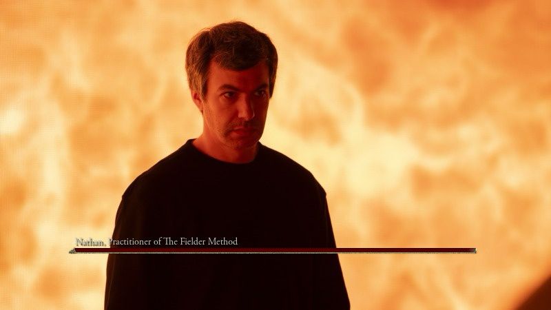 Nathan fielder standing in front of a wall of flames with an Elden Ring health bar. Above the bar is “Nathan, Practitioner of the Fielder Method”