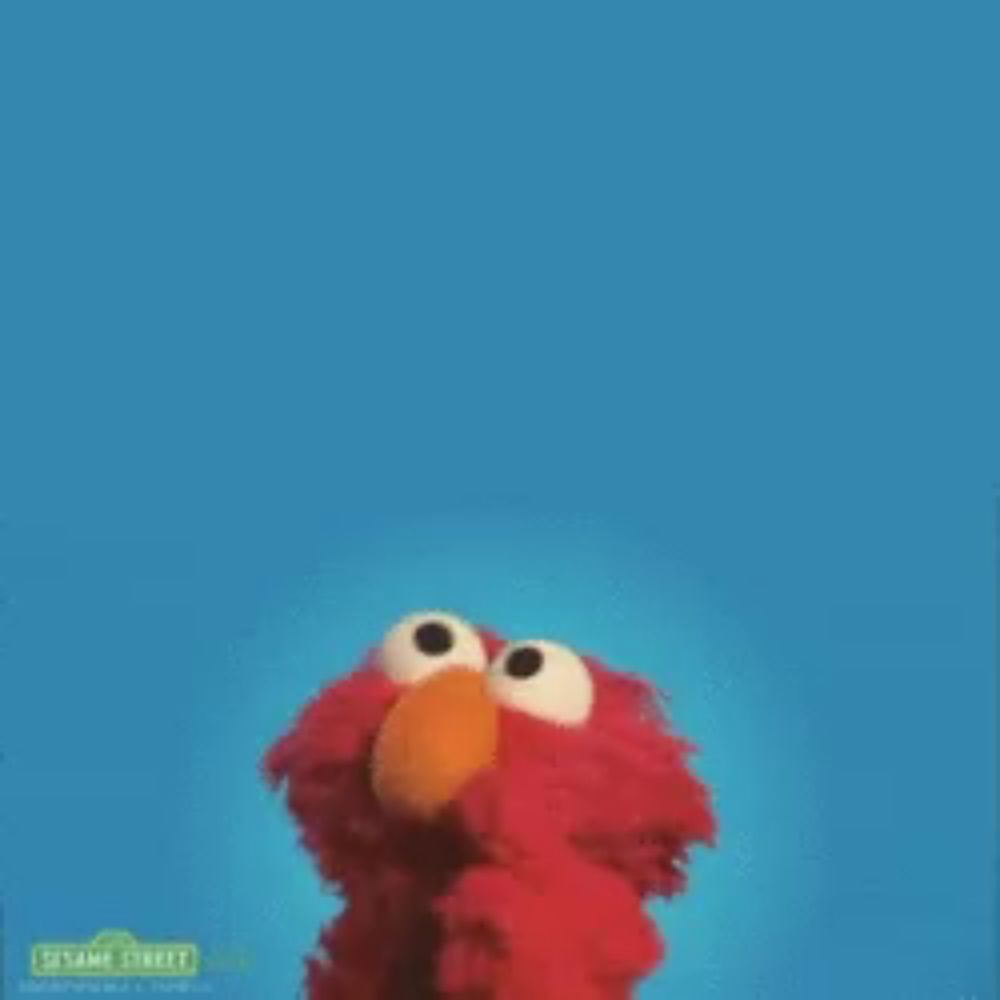 elmo from sesame street is standing in front of a blue background