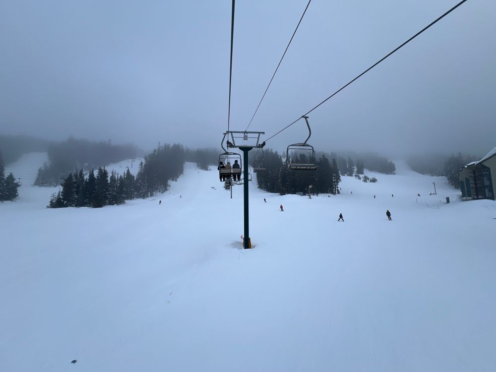 A ski lift over a snow slope