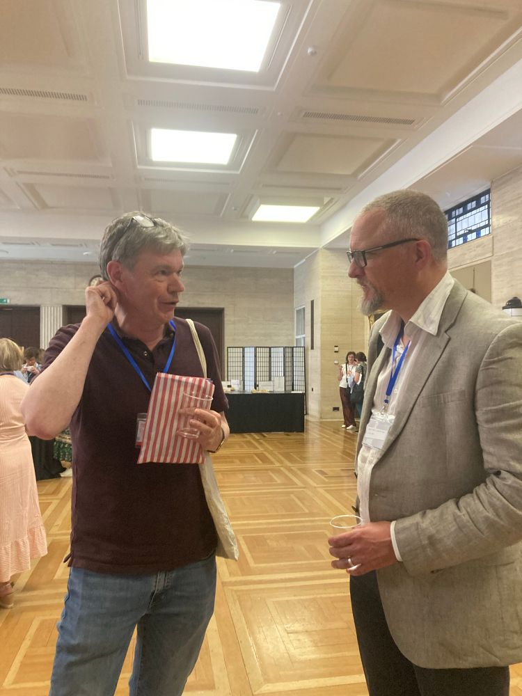 Photo of Rob Eastaway and Ewan Fernie at the conference.