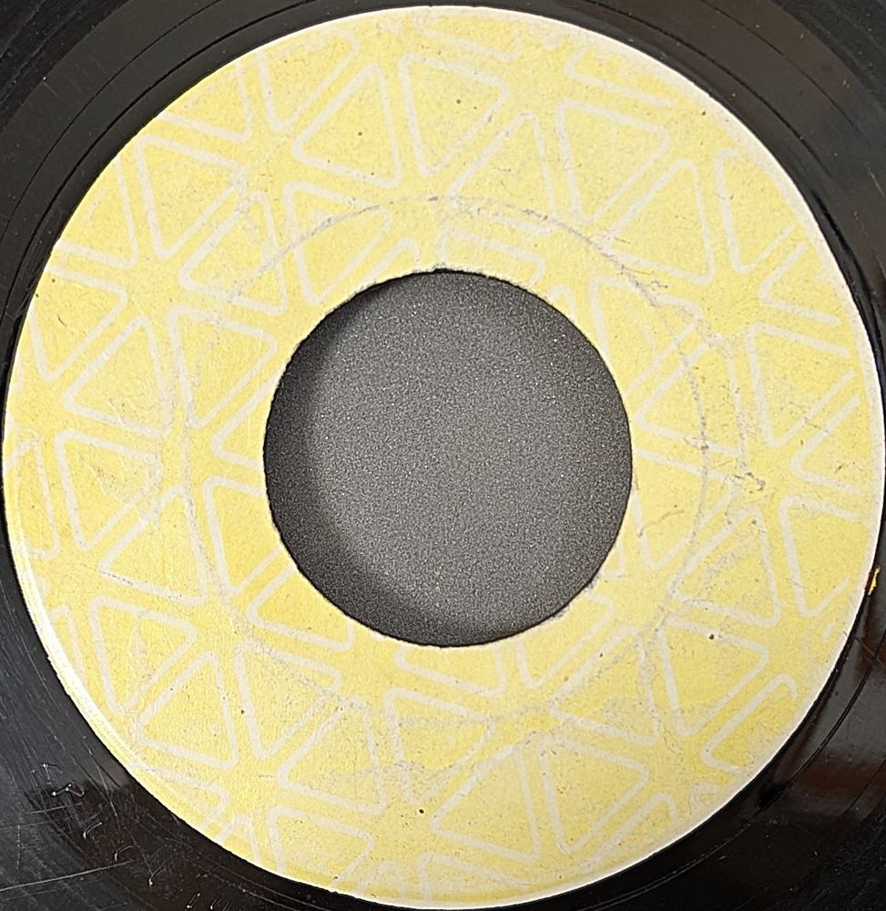 7" B side is a blank label of The Revolutionaries - Ghetto Dub.