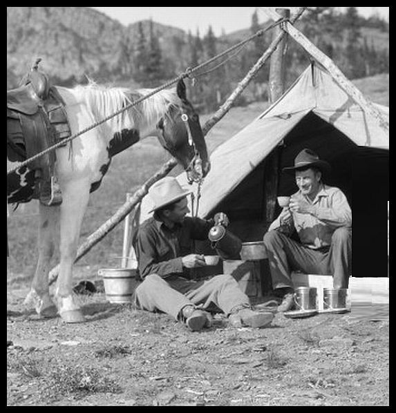 2 Cowboys Having Breakfast & Coffee outside of a tent with a horse. No date.  From the landscape the photo may have been taken in the Rockies.