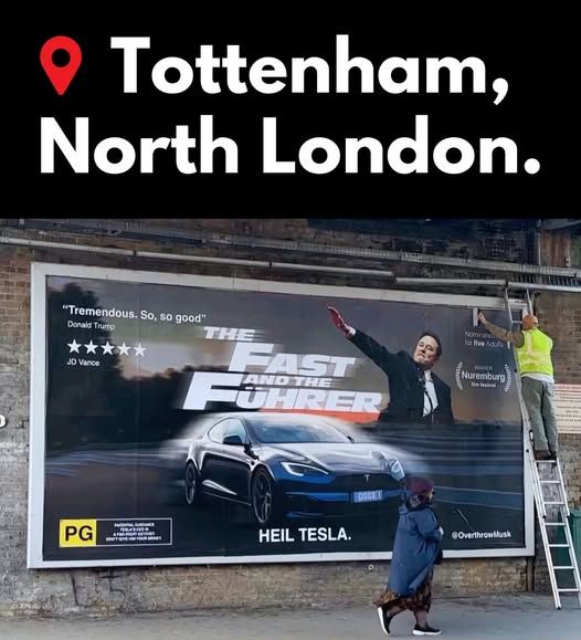 "Movie" Billboard posted in Tottenham North London, UK.  Image of Musk doing the Nazi salute with a Tesla care front and center.  On the left side are rave reviews from Trump and JD Vance.  One the right is an "award" from the Nurenburg film festival.