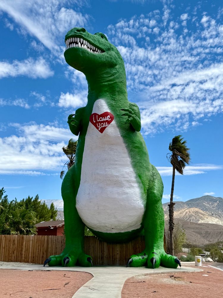 Mr. Rex at Cabazon, a large T-Rex statue painted green with “I love you” on its chest