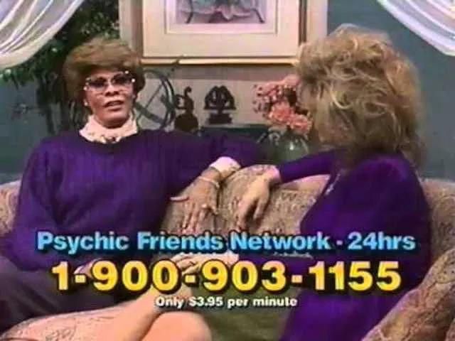 That's some hair! Still from at late 80s era psychic friends network tv ad, two women in purple are chatting on a couch. Hair is really done. Psychic friends network, 1-900-903-1155, only 3.95 per minute