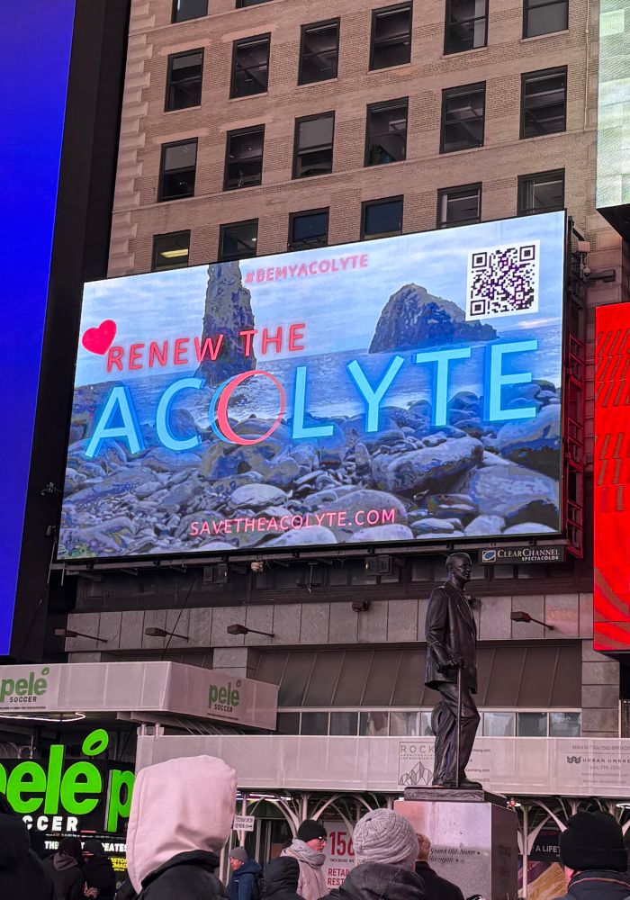 Photo of the Renew The Acolyte campaign digital billboard in Times Square, taken from the street below. 