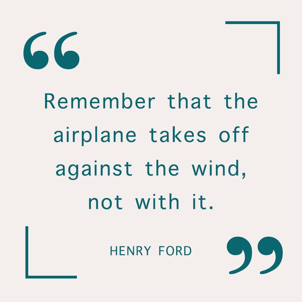 Inspirational quote from Henry Ford highlighting the importance of determination and progress, stating, “Remember the airplane takes off against the wind, not with it.”