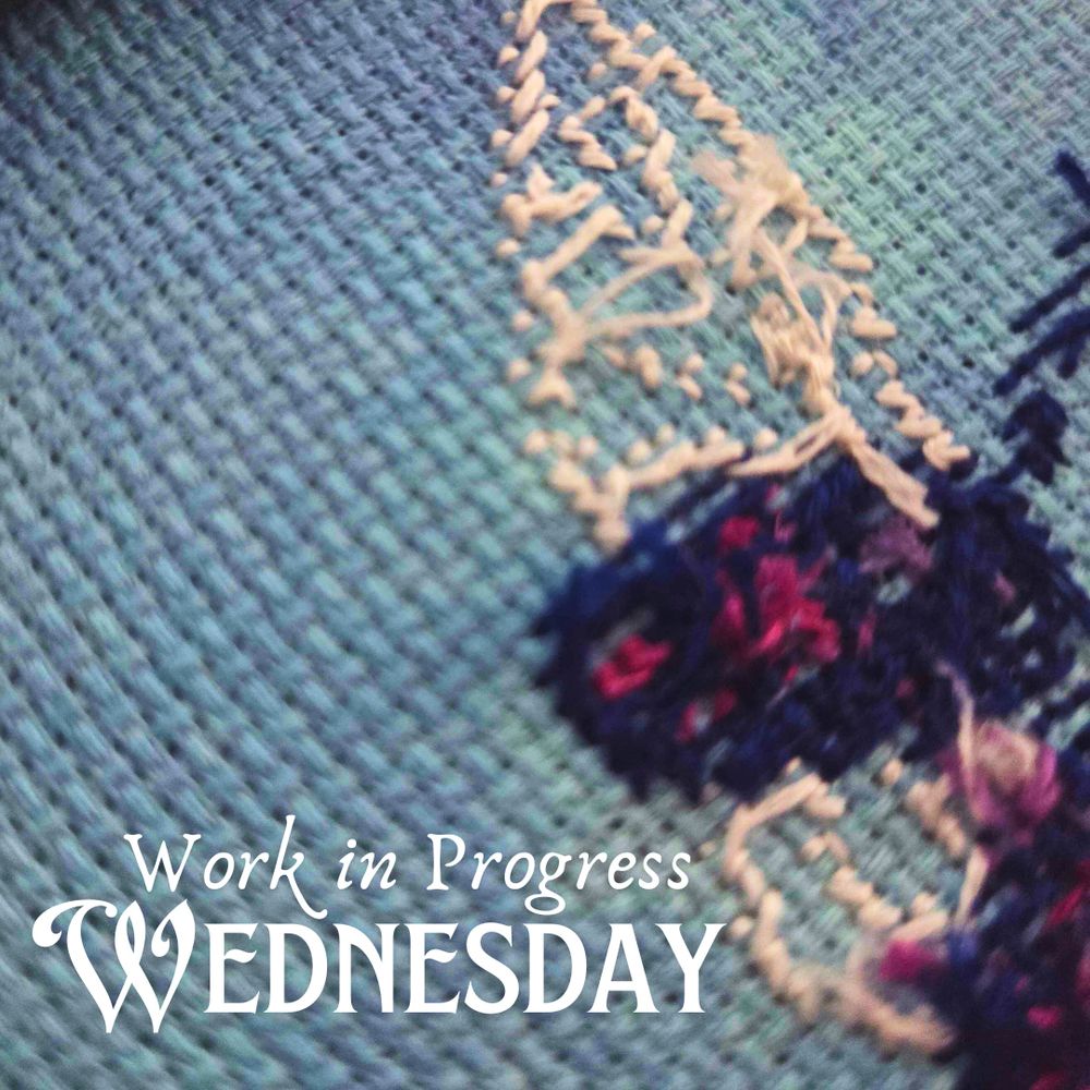 A closeup of the backside of a cross stitch project showing kind of near stitches of some sort of insect wing.  Text says Work in Progress Wednesday.