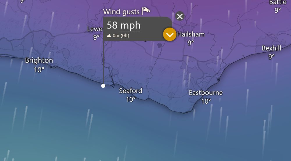 Screen grab from the Windy App showing the coast of East Sussex, and lines of prevailing winds from the south, moving north. It has a small flag on it pinned near Newhaven showing the gusts right now are around 58 miles per hour. Having walked out on the cliffs earlier in the evening, I believe it!