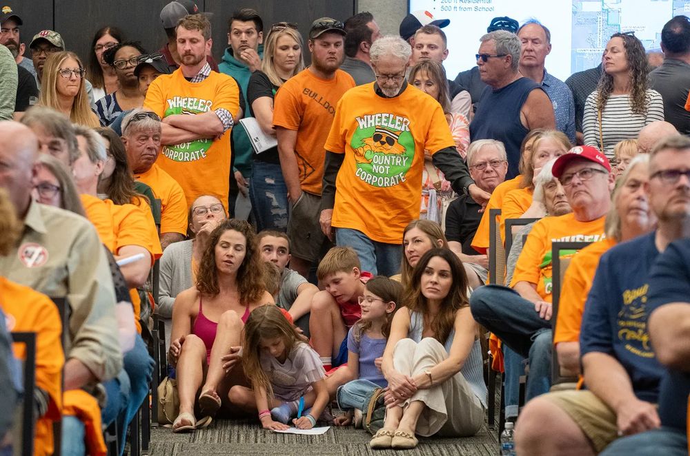 Hundreds rally at community meeting against proposed data center in Indiana. 