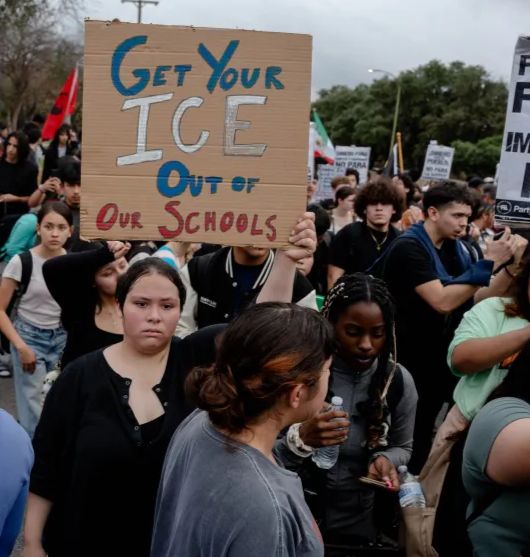 Student with sign, "Get Your ICE Out of Our Schools"